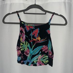 Floral crop top. Black background with a variety of colors.